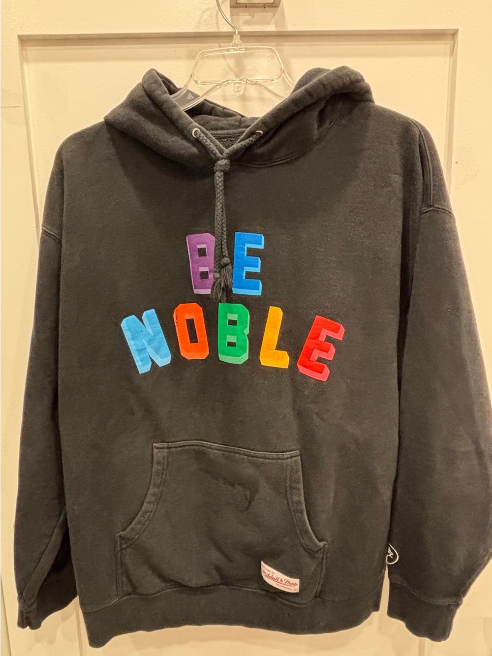 Mitchell & Ness Black Hoodie with Multicolor 'BE NOBLE' Lettering